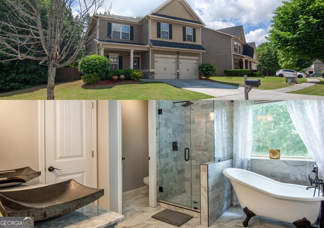 4271 Haywater Cv, Buford, GA 30519 - craftsman-style home with an attached garage, driveway, a front yard, and covered porch