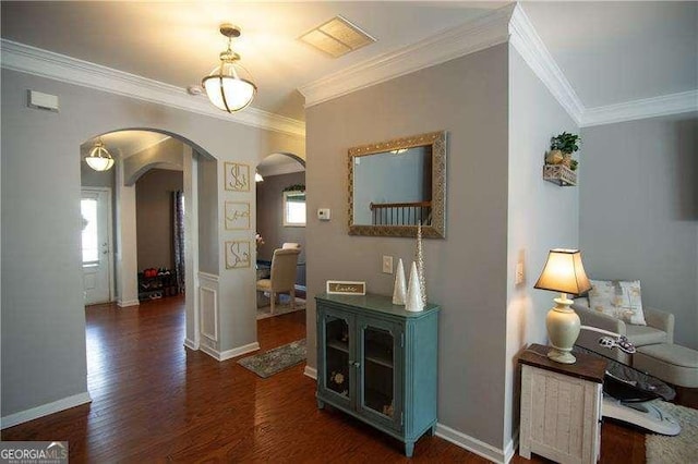 4271 Haywater Cv, Buford, GA 30519 - hall featuring arched walkways, crown molding, wood finished floors, and baseboards