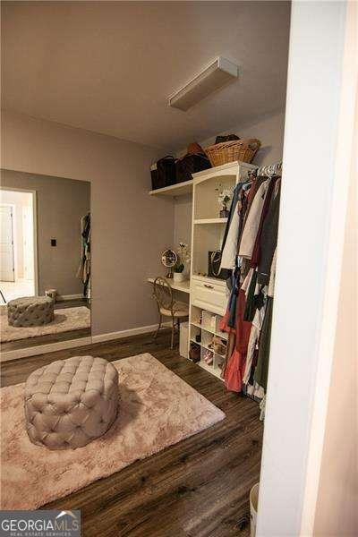 4271 Haywater Cv, Buford, GA 30519 - walk in closet with wood finished floors