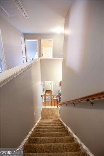 4271 Haywater Cv, Buford, GA 30519 - stairway with attic access, carpet flooring, and baseboards