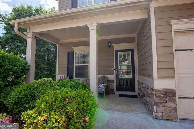 4271 Haywater Cv, Buford, GA 30519 - property entrance with covered porch and stone siding