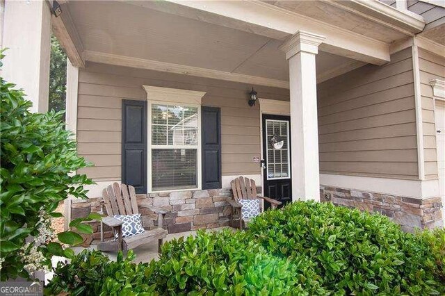 4271 Haywater Cv, Buford, GA 30519 - property entrance with a porch and stone siding