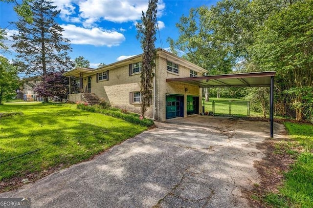 view of home's exterior with a carport, brick siding, an attached garage, and asphalt driveway
