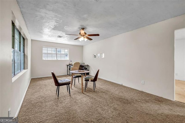 dining room featuring carpet and ceiling fan