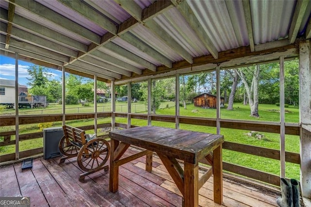 sunroom / solarium featuring outdoor dining area