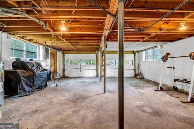 garage with concrete block wall
