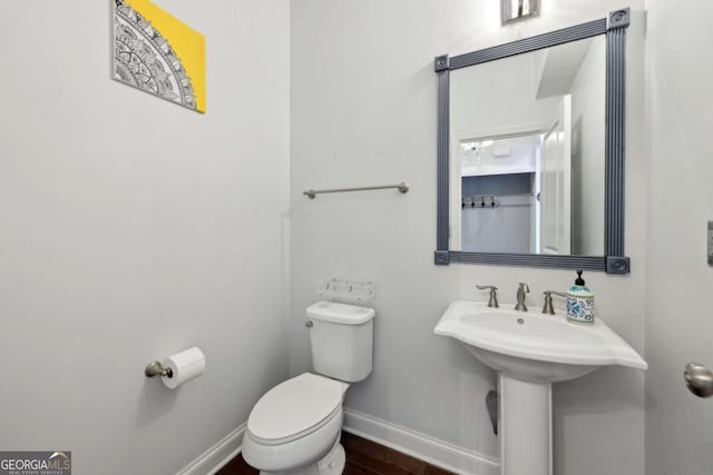 4630 Carriage Walk Ln, Cumming, GA 30040 - half bath with toilet and wood finished floors