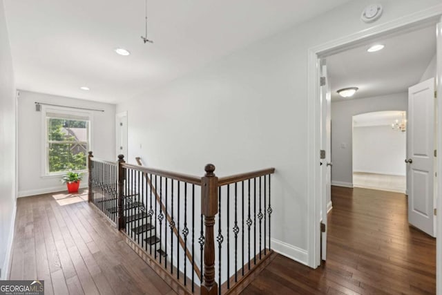 4630 Carriage Walk Ln, Cumming, GA 30040 - hall with an upstairs landing, hardwood / wood-style flooring, a chandelier, recessed lighting, and arched walkways