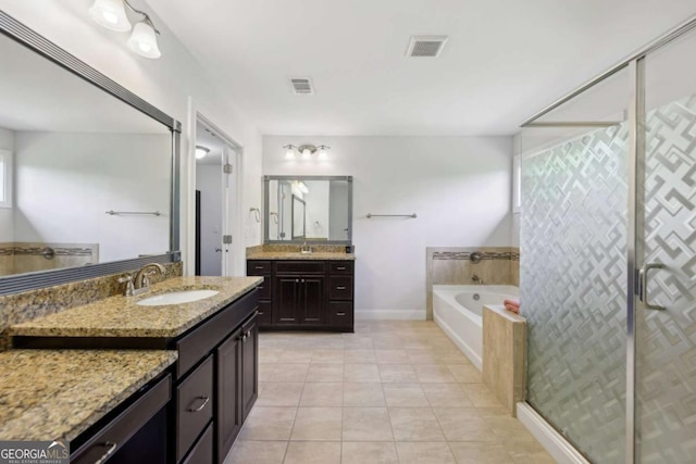 4630 Carriage Walk Ln, Cumming, GA 30040 - full bath with tile patterned flooring, a bath, two vanities, and a stall shower
