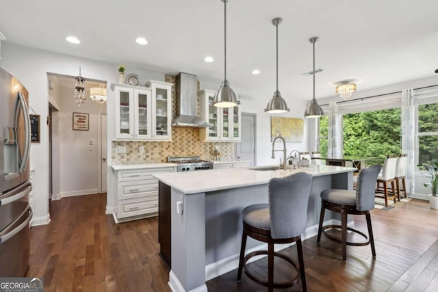 4630 Carriage Walk Ln, Cumming, GA 30040 - kitchen with wall chimney exhaust hood, stainless steel fridge with ice dispenser, light countertops, stove, and dark wood-style flooring