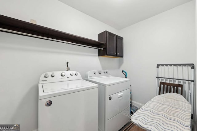 4630 Carriage Walk Ln, Cumming, GA 30040 - laundry area with cabinet space and washing machine and clothes dryer