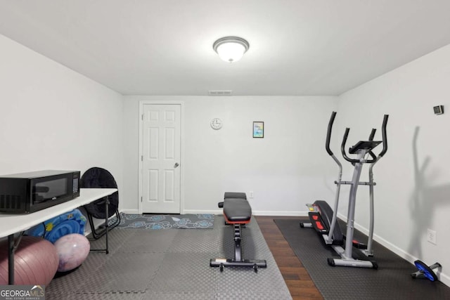 4630 Carriage Walk Ln, Cumming, GA 30040 - exercise room featuring baseboards and dark wood-type flooring