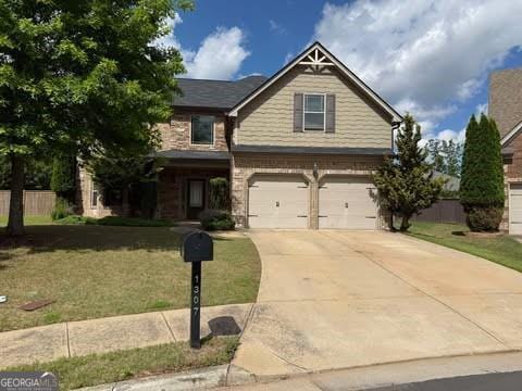 1307 Clarecastle Ln, Buford, GA 30519 - view of front of property featuring an attached garage, driveway, and brick siding