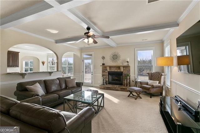 1307 Clarecastle Ln, Buford, GA 30519 - living area featuring carpet, crown molding, coffered ceiling, ceiling fan, and a stone fireplace