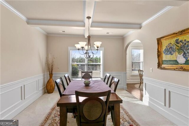 1307 Clarecastle Ln, Buford, GA 30519 - dining room with arched walkways, light colored carpet, a chandelier, a decorative wall, and beamed ceiling