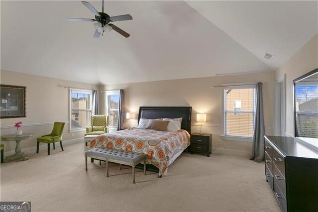 1307 Clarecastle Ln, Buford, GA 30519 - bedroom with light colored carpet, multiple windows, a ceiling fan, baseboards, and high vaulted ceiling