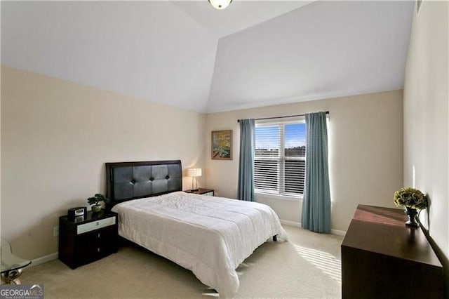 1307 Clarecastle Ln, Buford, GA 30519 - bedroom featuring light carpet, lofted ceiling, and baseboards
