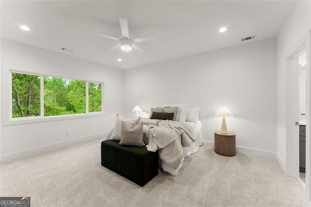 bedroom with light colored carpet, baseboards, recessed lighting, and ceiling fan