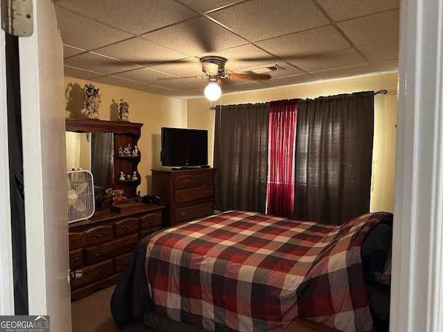 bedroom featuring a paneled ceiling and ceiling fan
