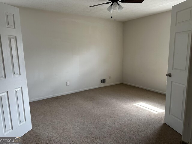 2195 Wilson Rd NW, Conyers, GA 30012 - carpeted empty room with a ceiling fan and baseboards