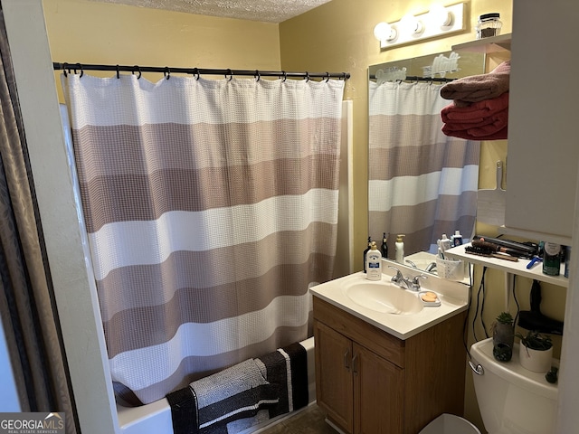 full bath featuring toilet, shower / tub combo, a textured ceiling, and vanity