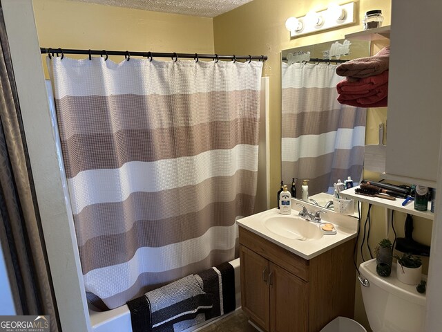 2195 Wilson Rd NW, Conyers, GA 30012 - full bath featuring toilet, shower / tub combo, a textured ceiling, and vanity