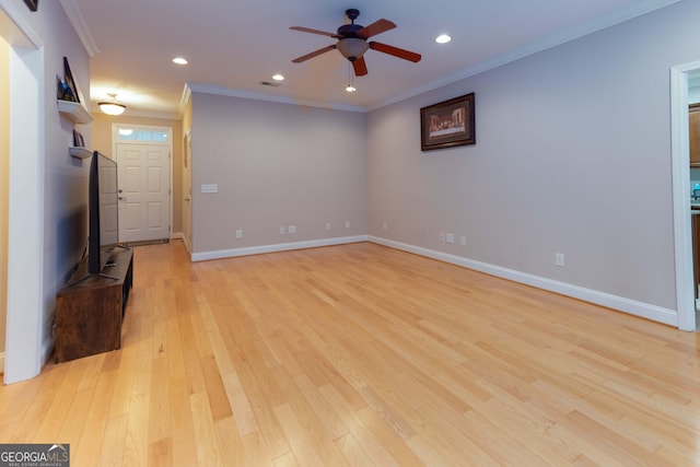 spare room with a ceiling fan, light wood-style flooring, recessed lighting, baseboards, and crown molding