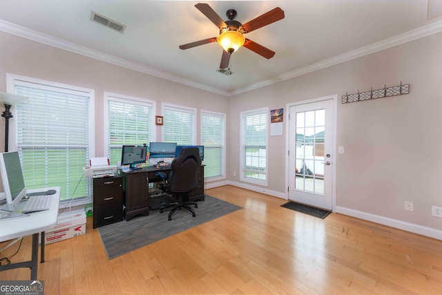 office featuring light wood-type flooring, ornamental molding, baseboards, and ceiling fan