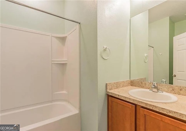 full bath with vanity and washtub / shower combination