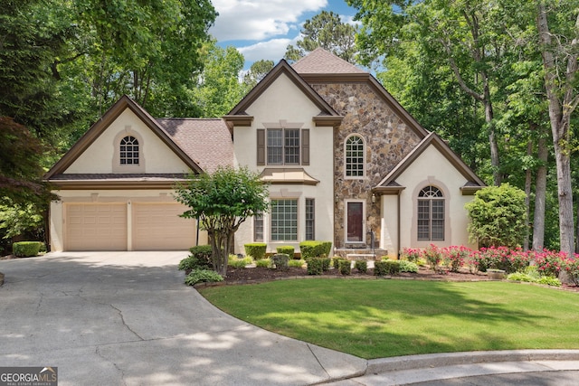 936 Bramble Oak Ct, Powder Springs, GA 30127 - french country home with stucco siding, stone siding, and concrete driveway