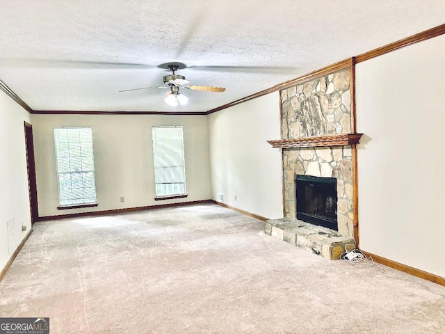305 Glenloch Ln, Stockbridge, GA 30281 - unfurnished living room with ornamental molding, a ceiling fan, carpet floors, a fireplace, and baseboards