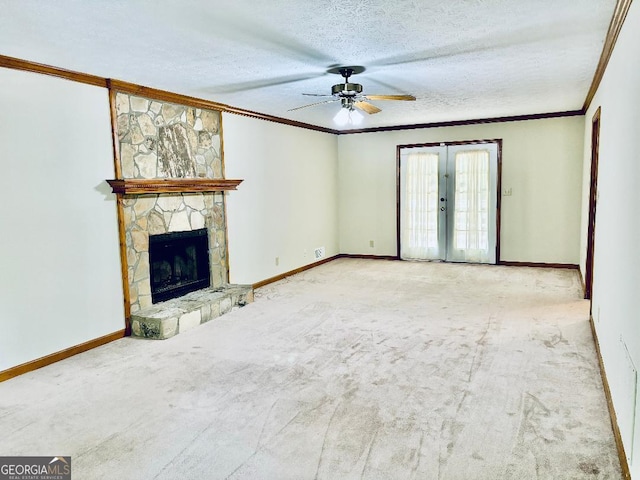 305 Glenloch Ln, Stockbridge, GA 30281 - unfurnished living room with ornamental molding, a ceiling fan, baseboards, carpet flooring, and a textured ceiling