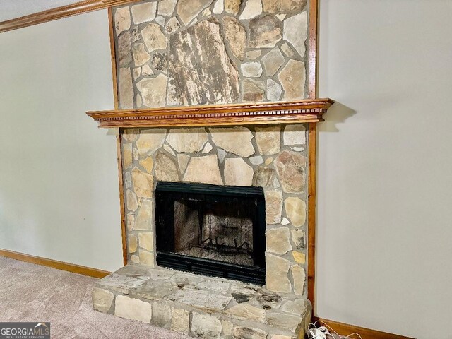 305 Glenloch Ln, Stockbridge, GA 30281 - detailed view of carpet, a fireplace, and ornamental molding