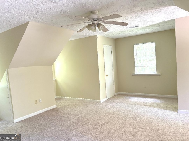 305 Glenloch Ln, Stockbridge, GA 30281 - additional living space with carpet flooring, ceiling fan, a textured ceiling, and baseboards