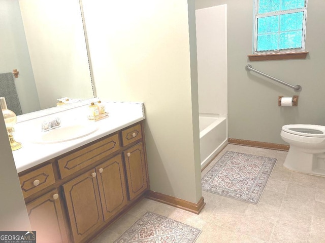 305 Glenloch Ln, Stockbridge, GA 30281 - full bath featuring baseboards, toilet, vanity, and a bath
