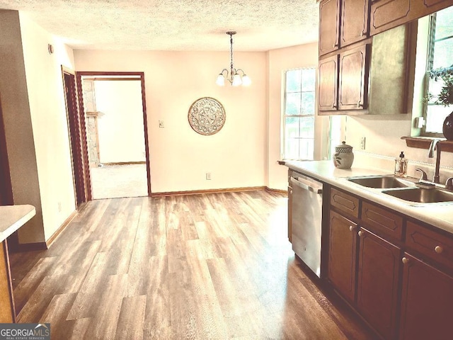 305 Glenloch Ln, Stockbridge, GA 30281 - kitchen with dishwasher, a sink, light wood finished floors, light countertops, and baseboards