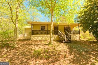 10213 Tall Pine Ct, Villa Rica, GA 30180 - view of front facade with a porch and stairway
