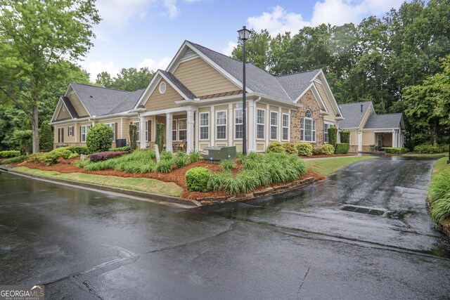 2595 Grapevine Cir, Cumming, GA 30041 - view of front facade featuring asphalt driveway, a shingled roof, and cooling unit