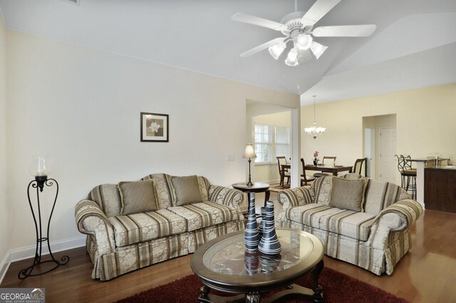 2595 Grapevine Cir, Cumming, GA 30041 - living room featuring ceiling fan, wood finished floors, a chandelier, baseboards, and high vaulted ceiling