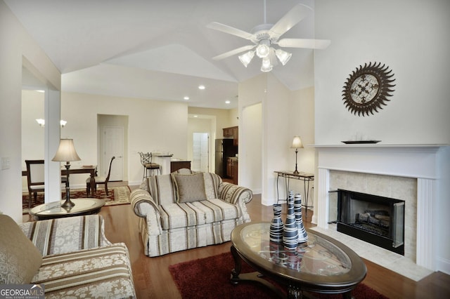 2595 Grapevine Cir, Cumming, GA 30041 - living room with wood finished floors, vaulted ceiling, a ceiling fan, a fireplace, and recessed lighting