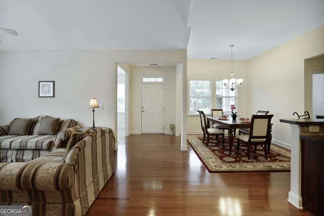 2595 Grapevine Cir, Cumming, GA 30041 - living area featuring dark wood-type flooring, a chandelier, and baseboards