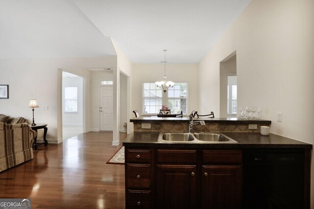 2595 Grapevine Cir, Cumming, GA 30041 - kitchen featuring a sink, a chandelier, dark countertops, dark wood-style flooring, and black dishwasher