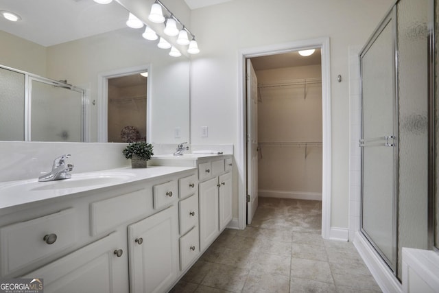 2595 Grapevine Cir, Cumming, GA 30041 - full bathroom featuring a stall shower, double vanity, and a spacious closet