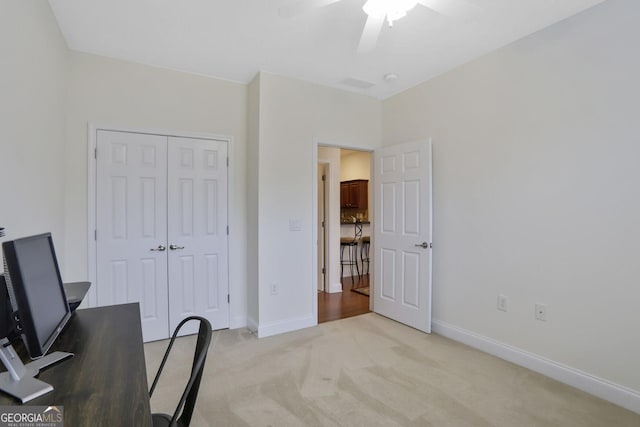 2595 Grapevine Cir, Cumming, GA 30041 - home office with light colored carpet, ceiling fan, and baseboards