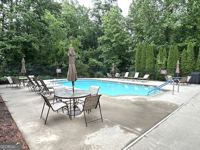 2595 Grapevine Cir, Cumming, GA 30041 - community pool featuring fence and a patio area