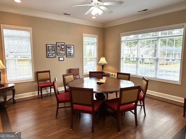 2595 Grapevine Cir, Cumming, GA 30041 - dining area with dark wood-style floors, healthy amount of natural light, baseboards, and crown molding