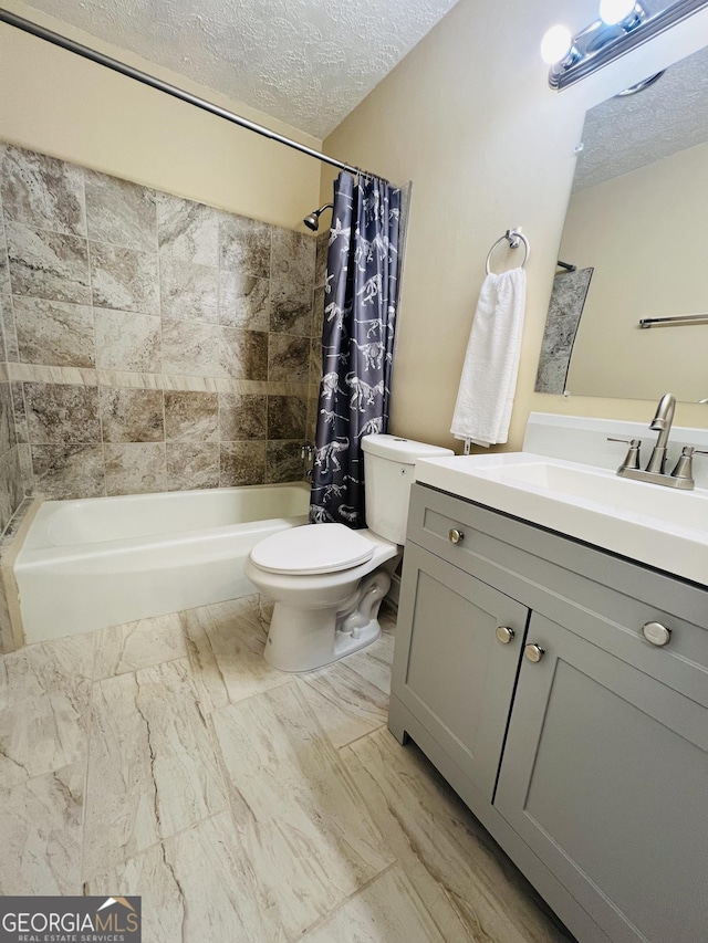 full bathroom with a textured ceiling, shower / bath combo, toilet, and vanity
