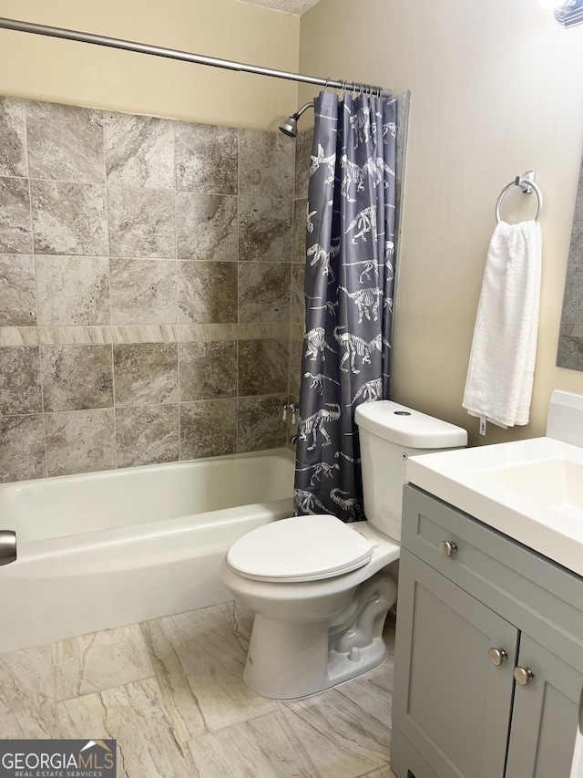 bathroom featuring shower / tub combo, toilet, and vanity