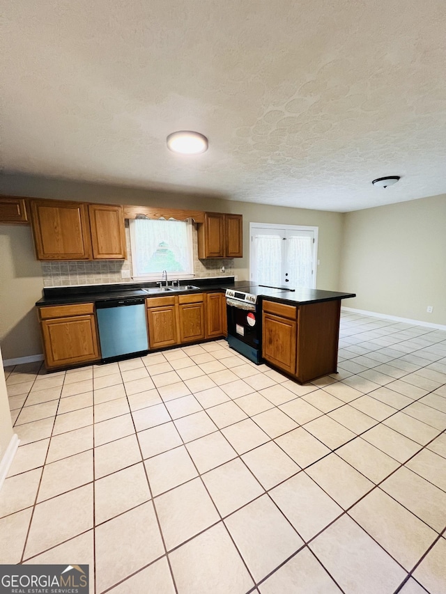 kitchen featuring dishwasher, stainless steel electric stove, dark countertops, baseboards, and a textured ceiling