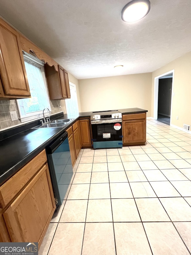 kitchen with stainless steel range with electric stovetop, a sink, dishwashing machine, dark countertops, and light tile patterned floors